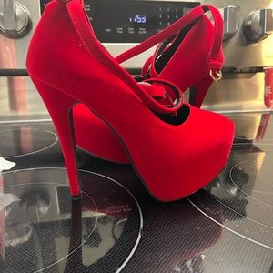 Red suede pumps